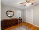 Airy bedroom featuring hardwood floors, natural light, and a heart-shaped mirror at 1223 Union St, Clearwater, FL 33755