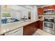 Modern kitchen featuring granite countertops, stainless steel appliances, and ample cabinet space at 1223 Union St, Clearwater, FL 33755