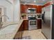 Well-equipped kitchen featuring stainless steel appliances and ample counter space at 1223 Union St, Clearwater, FL 33755
