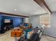 Basement living area features tiled flooring, neutral paint, and wood beams for a homey feel at 1223 Union St, Clearwater, FL 33755