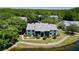 Aerial view of condos surrounded by lush landscaping and water features at 1337 Pine Ridge E Cir # D2, Tarpon Springs, FL 34688