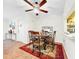 Cozy dining area with chandelier and seating for four guests at 1337 Pine Ridge E Cir # D2, Tarpon Springs, FL 34688