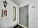 Exterior front door with secure entry and building details at 1337 Pine Ridge E Cir # D2, Tarpon Springs, FL 34688