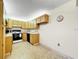 Efficient kitchen with ample cabinet space and clean, easy-care floor at 1337 Pine Ridge E Cir # D2, Tarpon Springs, FL 34688