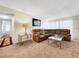 Bright living room featuring comfortable seating and plenty of natural light at 1337 Pine Ridge E Cir # D2, Tarpon Springs, FL 34688