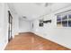 Bright living room features laminate floors, a decorative door and two windows at 1339 13Th W St, Bradenton, FL 34205