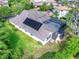 Stunning home featuring a screened pool, solar panels, and a well-manicured lawn, perfect for outdoor enjoyment at 16318 Palmettoglen Ct, Lithia, FL 33547