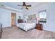 Comfortable bedroom with plenty of natural light and neutral décor at 16318 Palmettoglen Ct, Lithia, FL 33547
