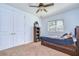 Bright bedroom with large window, ceiling fan, closet and a trundle bed for extra sleeping space at 16318 Palmettoglen Ct, Lithia, FL 33547