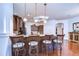 Kitchen island featuring countertop seating illuminated by pendant lighting at 16318 Palmettoglen Ct, Lithia, FL 33547