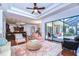 Spacious living area with seamless access to the kitchen, dining area, and outdoor living space at 16318 Palmettoglen Ct, Lithia, FL 33547