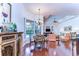 Open-concept living space with dining area, views of the pool, and connection to the kitchen at 16318 Palmettoglen Ct, Lithia, FL 33547