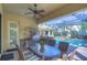 Beautiful outdoor kitchen and dining area with built in grill and spacious pool at 16318 Palmettoglen Ct, Lithia, FL 33547