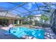Backyard swimming pool with adjacent hot tub and basketball hoop at 16318 Palmettoglen Ct, Lithia, FL 33547