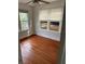 Bedroom with hardwood floors and multiple windows offers ample natural light at 1801 12Th N St, St Petersburg, FL 33704