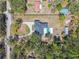 Overhead aerial view shows home and grounds in a natural setting at 18214 Ozark Dr, Hudson, FL 34667