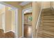 Staircase next to a bedroom provides easy access to the upper level at 18716 Lake Commiston Dr, Lutz, FL 33549