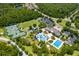 Aerial view of the community amenities including pool, tennis courts, and green space at 20118 Heron Crossing Dr, Tampa, FL 33647