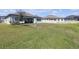 Large backyard with covered patio and ample room for outdoor living and recreation at 21396 Snowy Orchid Ter, Land O Lakes, FL 34637
