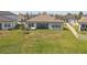 Aerial view of a spacious backyard with a patio, with ample space for outdoor enjoyment and relaxation at 21396 Snowy Orchid Ter, Land O Lakes, FL 34637