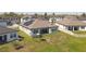 An aerial capturing a peaceful backyard view, enhanced by solar panels for energy efficiency and sustainability at 21396 Snowy Orchid Ter, Land O Lakes, FL 34637
