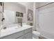 Modern bathroom with a shower-tub combination and neutral-colored vanity at 21396 Snowy Orchid Ter, Land O Lakes, FL 34637