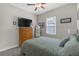Comfortable bedroom featuring a queen bed and ample natural light at 21396 Snowy Orchid Ter, Land O Lakes, FL 34637