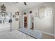 This bedroom features white doors for the closet and ensuite bathroom, and a bookshelf at 21396 Snowy Orchid Ter, Land O Lakes, FL 34637