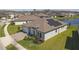 Stunning single-story home with a two-car garage, solar panels, and lush landscaping in a desirable community at 21396 Snowy Orchid Ter, Land O Lakes, FL 34637