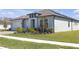 Charming home with well-manicured lawn and neatly landscaped flowerbeds enhancing curb appeal at 21396 Snowy Orchid Ter, Land O Lakes, FL 34637