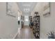 Inviting hallway with stylish decor and beautiful hardwood floors at 21396 Snowy Orchid Ter, Land O Lakes, FL 34637