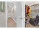 Spacious walk-in closet features organized storage shelves and ample room for clothes and accessories at 21396 Snowy Orchid Ter, Land O Lakes, FL 34637