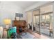 Bright home office featuring a classic desk and sunroom access through sliding glass doors at 2585 Northfield Ln, Clearwater, FL 33761