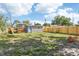 Fenced backyard features a charming shed, providing extra storage or a creative space at 2726 25Th N Ave, St Petersburg, FL 33713