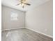Cozy bedroom with gray walls, hard flooring, and a window, with natural light at 2726 25Th N Ave, St Petersburg, FL 33713