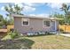 Charming single-story home featuring a well-maintained lawn, garden bed, and side yard at 2726 25Th N Ave, St Petersburg, FL 33713