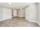 Open-concept living room with hardwood floors, ceiling fan, neutral paint, and lots of natural light at 2726 25Th N Ave, St Petersburg, FL 33713