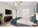 Cozy main bedroom with a plush bed, a flat screen tv, and ample closet space at 2726 25Th N Ave, St Petersburg, FL 33713