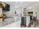 Modern kitchen features white cabinets, granite countertops, and sleek appliances at 2734 17Th N Ave, St Petersburg, FL 33713