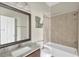Bathroom featuring vanity, granite countertop, and tiled shower at 4127 Broad Porch Run, Land O Lakes, FL 34638