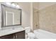 Bathroom with vanity, granite countertop, and tiled shower at 4127 Broad Porch Run, Land O Lakes, FL 34638