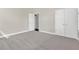 Spacious carpeted bedroom with neutral walls and natural light at 4127 Broad Porch Run, Land O Lakes, FL 34638