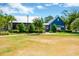 Lush community amenities with a 'Swim Club' building, gazebo and expansive lawn offering diverse leisure activities at 4127 Broad Porch Run, Land O Lakes, FL 34638