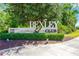 Welcoming Bexley Club sign with 'Pool Cafe' situated among mature landscaping and lush green foliage at 4127 Broad Porch Run, Land O Lakes, FL 34638