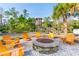 Outdoor fire pit area with Adirondack chairs for cozy gatherings at 4127 Broad Porch Run, Land O Lakes, FL 34638