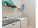 Bright laundry room boasts a Maytag washer and dryer at 4127 Broad Porch Run, Land O Lakes, FL 34638