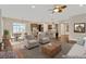 Open floor plan with kitchen, breakfast nook, and living room area featuring modern decor at 4127 Broad Porch Run, Land O Lakes, FL 34638