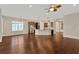 Open-concept living space with views of the kitchen, stainless appliances and large island at 4127 Broad Porch Run, Land O Lakes, FL 34638