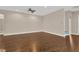 Large, open living area with hardwood floors and neutral color scheme at 4127 Broad Porch Run, Land O Lakes, FL 34638