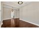 Spacious living area with hardwood floors, arched doorways, and an open, airy design at 4127 Broad Porch Run, Land O Lakes, FL 34638